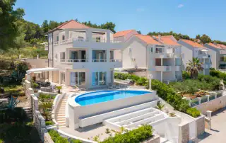 Modern white villa with swimming pool in Croatia, coastal vacation home.